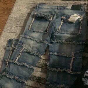 Stacked ripped jeans